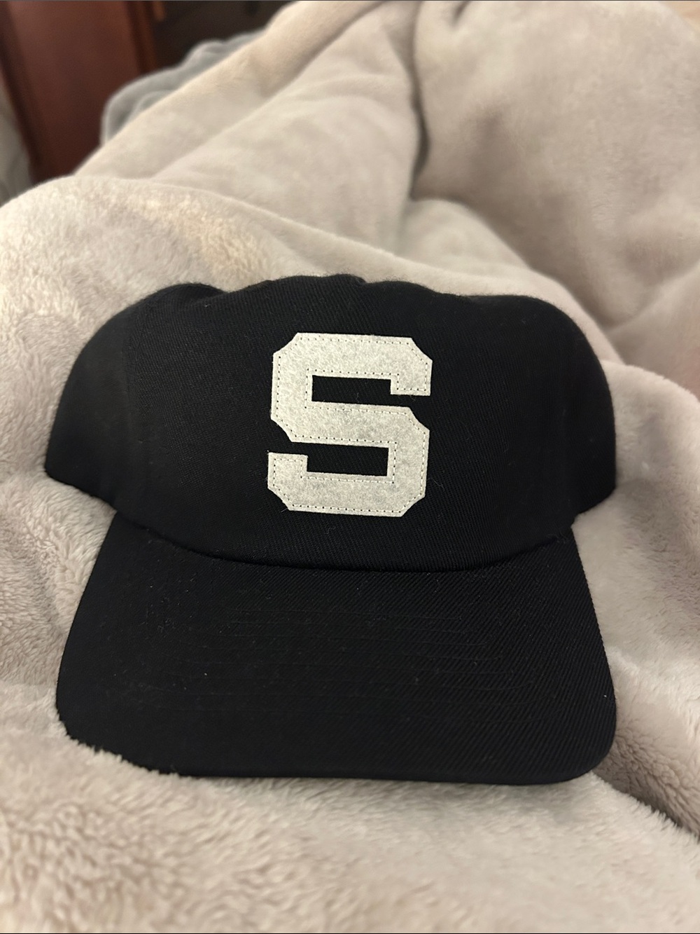 Black Baseball Cap with White 'S' Patch